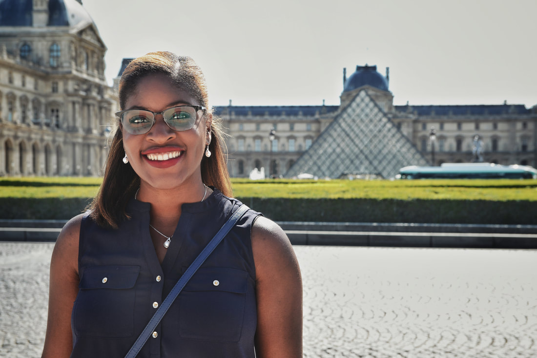 Ranthony Edmonds in front of the Louvre Museum in Paris, France.